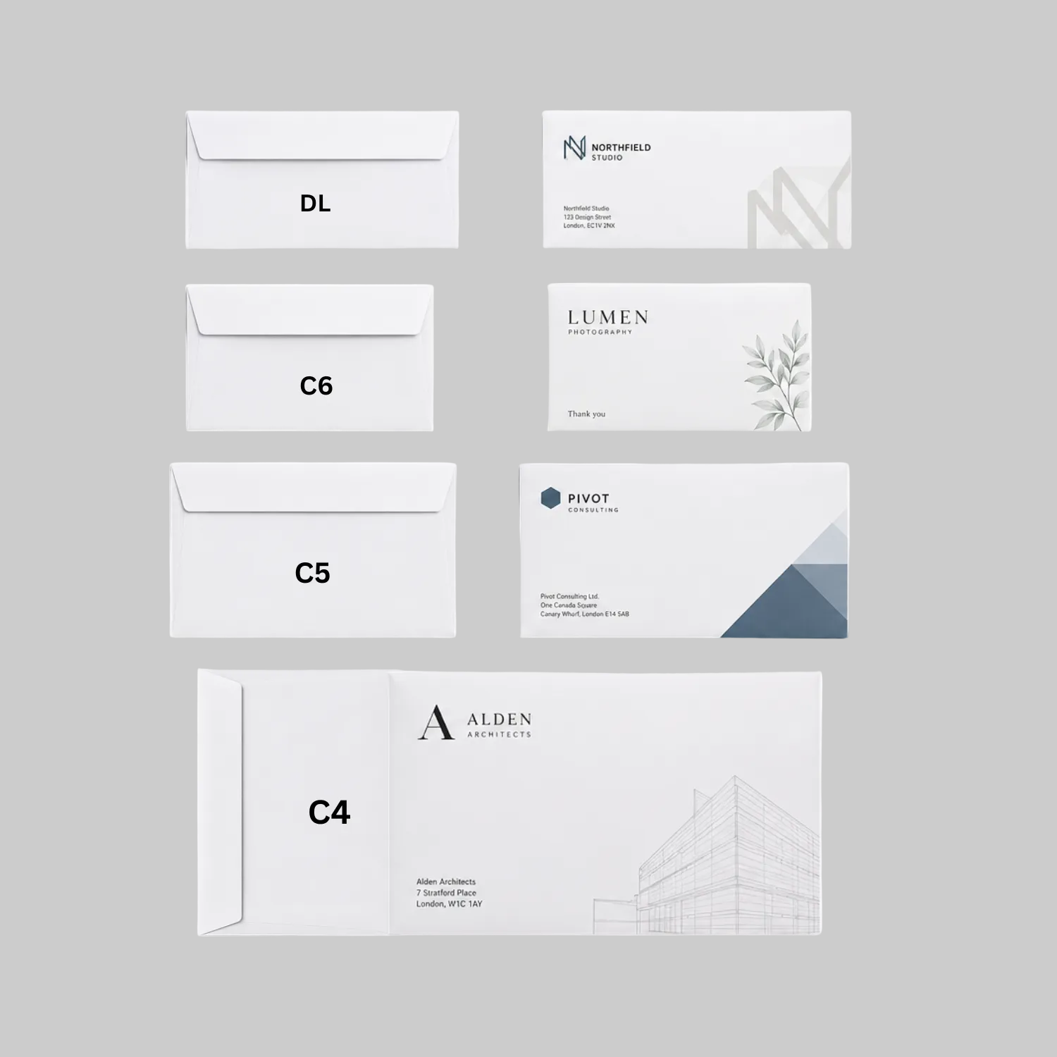 Collection of white envelopes with different sizes and branding labels on a white background