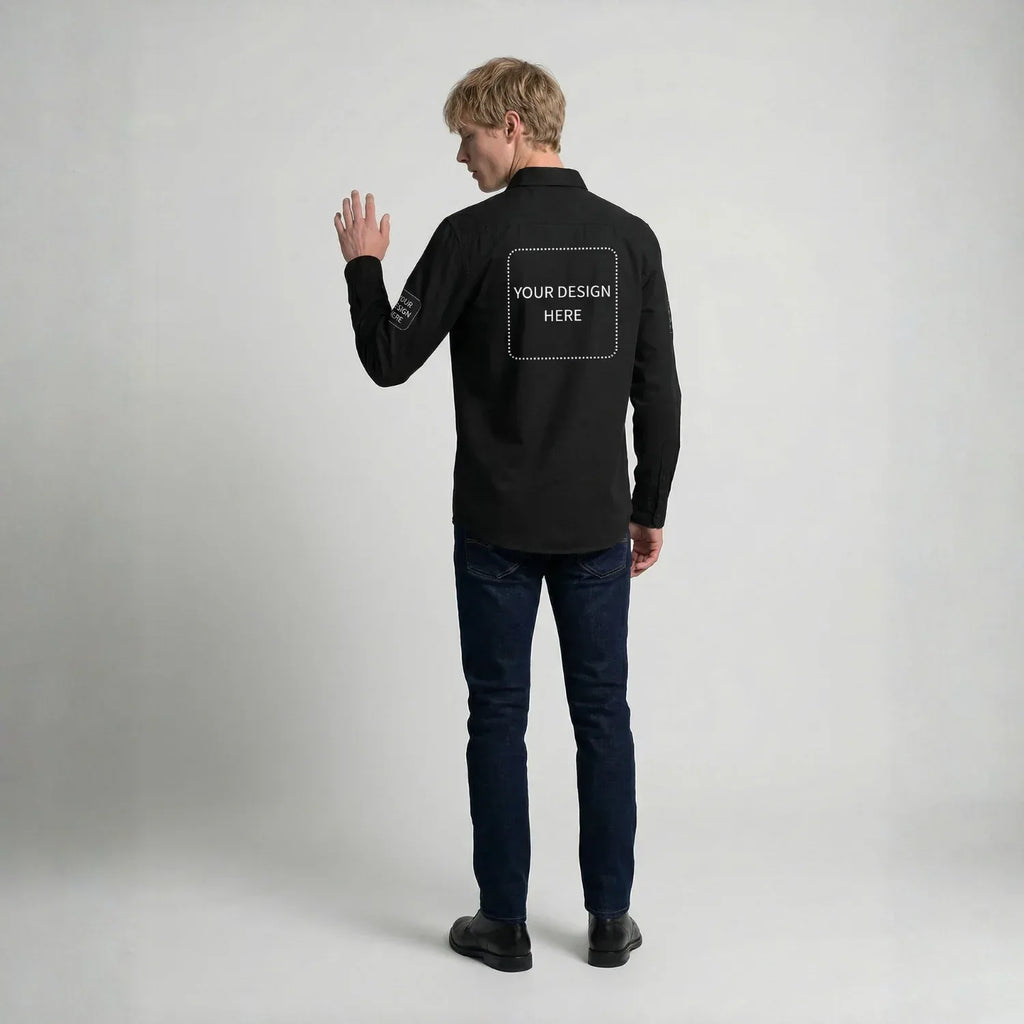 Man wearing a black long-sleeve shirt with a customizable design area on the back against a gray background